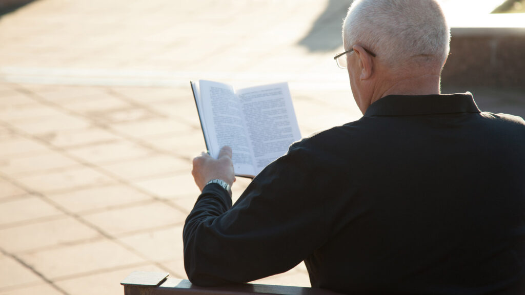 Old man reading a book