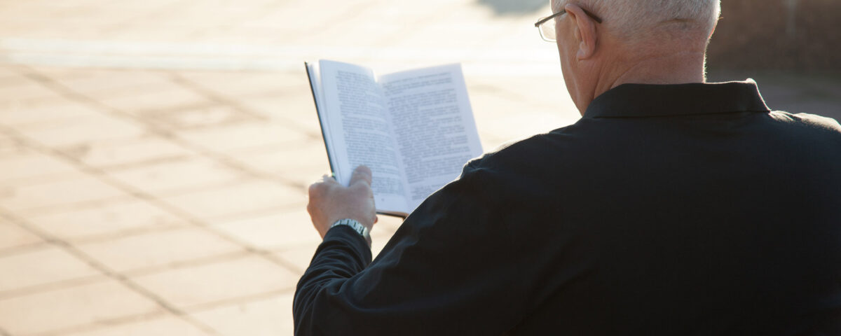 Old man reading a book