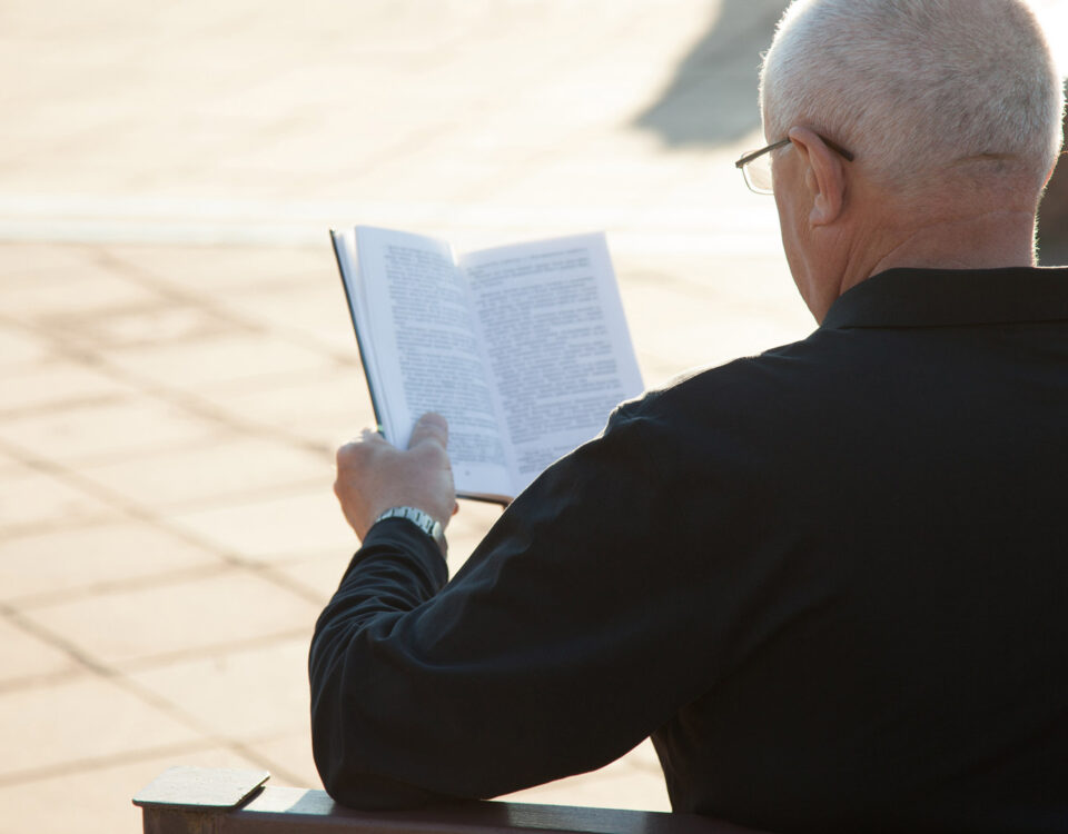 Old man reading a book